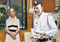 Kamal-Jain-(left)-who-drove-his-car-with-Assistant-Sub-Inspector-(ASI)-V-B-Jadhav-(right)-clinging-on-to-the-bonnet