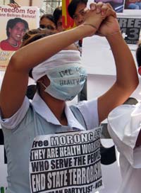 A-relative-of-one-of-the-arrested-health-care-workers-protests-outside-a-court
