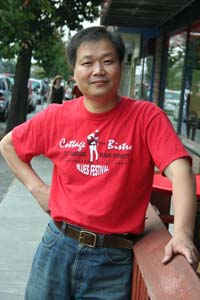 Eugene-Dong,-outside-his-Cottage-Bistro-on-Main-Street